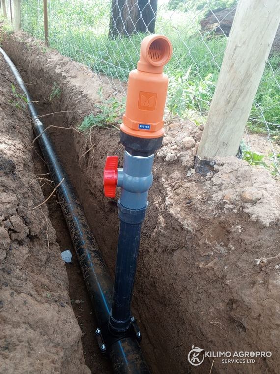 Buried mainline and riser in an open trench